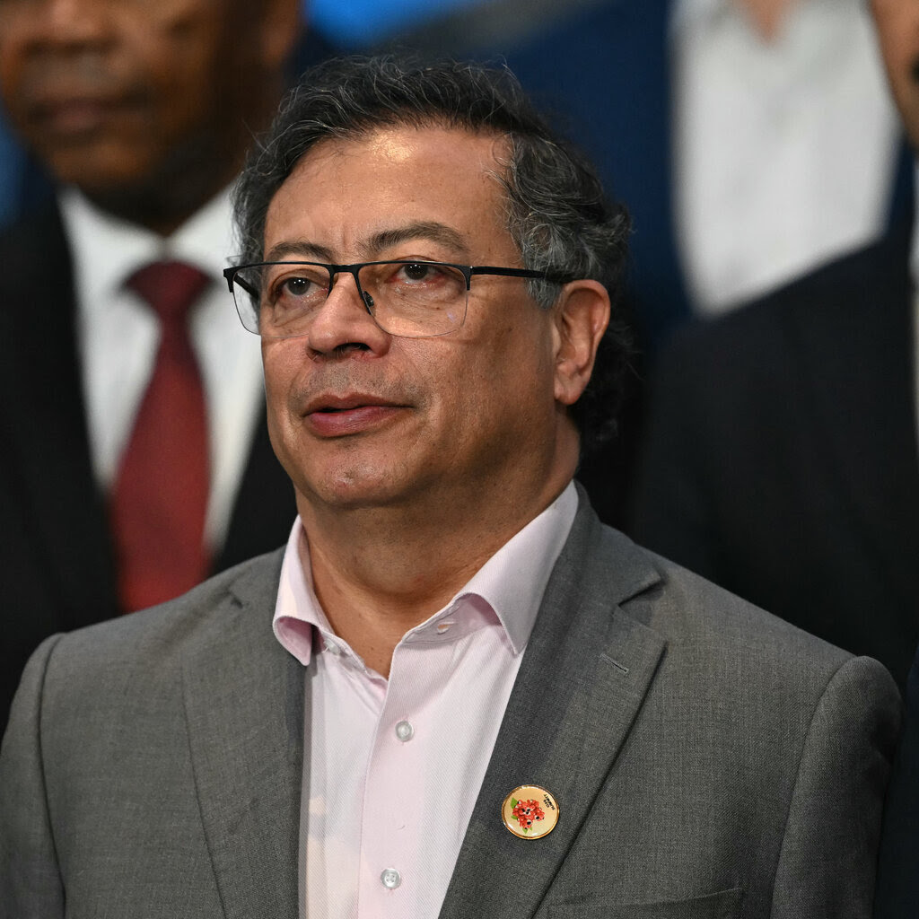 President Gustavo Petro of Colombia, wearing a sports coat and a light pink button-up shirt.