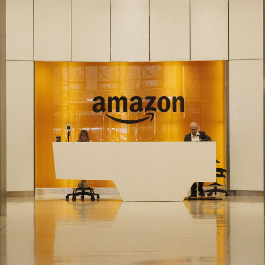 epa11516964 People sit at the front desk of Amazon's office building on 34th Street in New York, New York, USA, 01 August 2024. Amazon is set to release their Q2 earnings on 01 August 2024. EPA/SARAH YENESEL