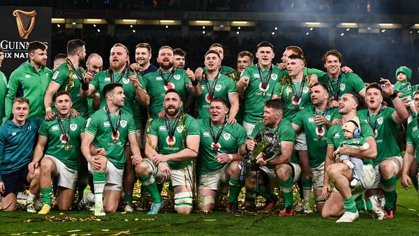 Ireland's players celebrate with the Six Nations trophy