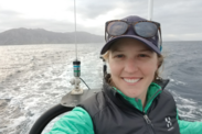 Selene Fregosi takes a selfie on a small boat moving through the water