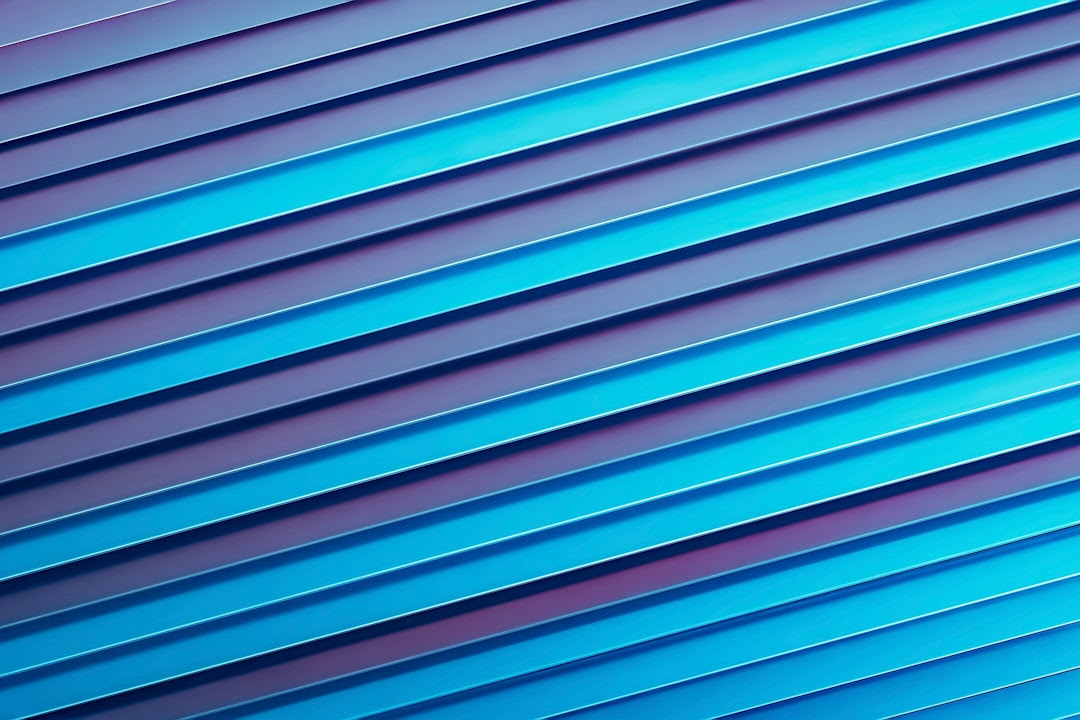 a close up of a blue wall with vertical lines