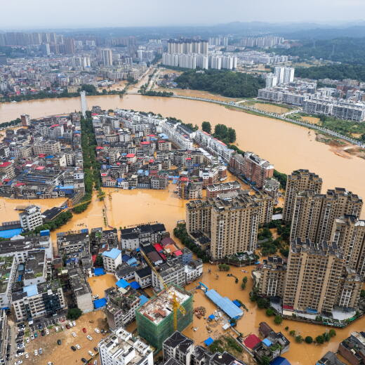 epa11452960 An aerial drone photo shows the waterlogged downtown of Pingjiang county, central China's Hunan Province, July 2, 2024. The flooding water in Pingjiang county is gradually declining Tuesday with the water level of Pingjiang watch station of the Miluo River at 76.18 meters, still 5.68 meters above the warning mark, but 1.49 meters lower than the peak level. EPA/XINHUA / Chen Sihan CHINA OUT / UK AND IRELAND OUT / MANDATORY CREDIT EDITORIAL USE ONLY