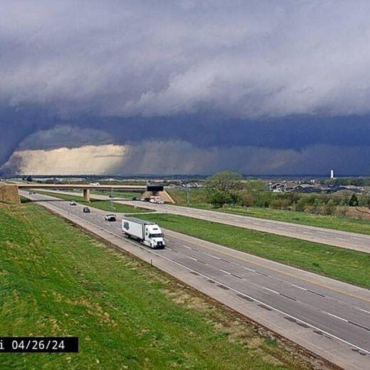 This traffic cam image obtained from the Nebraska Department of Transportation shows a tornado crossing Interstate Highway 80 near Waverly, Nebraska, on April 26, 2024. Dozens of tornadoes struck the central US on April 26, razing homes, knocking down power lines and injuring at least three people, authorities said. More than 70 tornadoes were recorded across the country by the National Weather Service (NWS), most of them around Omaha, a transportation hub in Nebraska. (Photo by Handout / Nebraska Department of Transportation / AFP) / RESTRICTED TO EDITORIAL USE - MANDATORY CREDIT "AFP PHOTO / Nebraska Department of Transportation" - NO MARKETING NO ADVERTISING CAMPAIGNS - DISTRIBUTED AS A SERVICE TO CLIENTS