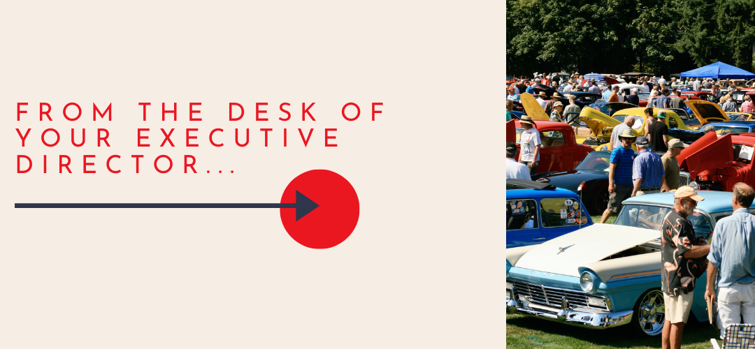 from the desk of your executive director with an image of a crowd from the car and boat show