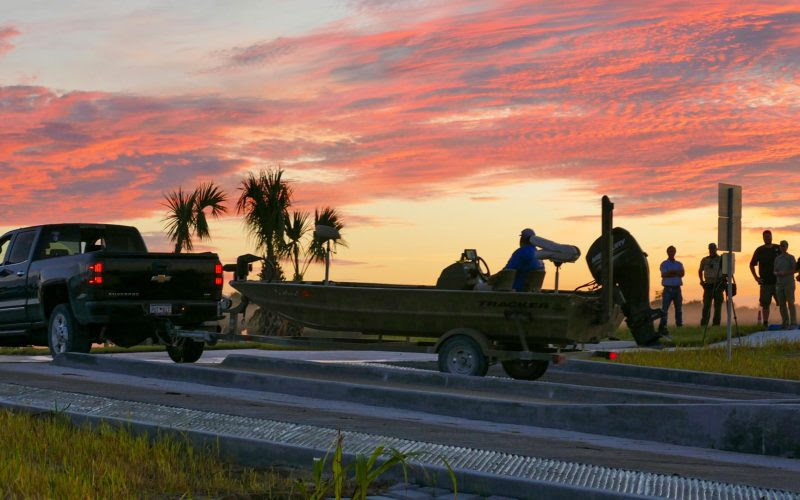 A fishing boat being launched in the early morning