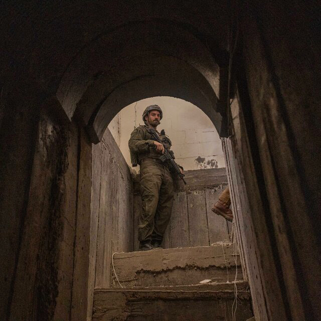 An Israeli soldier framed in the arched entryway to a tunnel. 