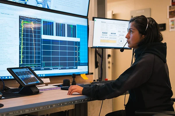 Natalia Cisterna assists with conductivity, temperature, and depth operations via computer on Research Vessel Falkor (too).