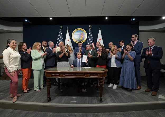 Sen. Cortese stands with fellow legislators and then-Acting Governor Mike McGuire to witness the signing of AB 247 and SB 867