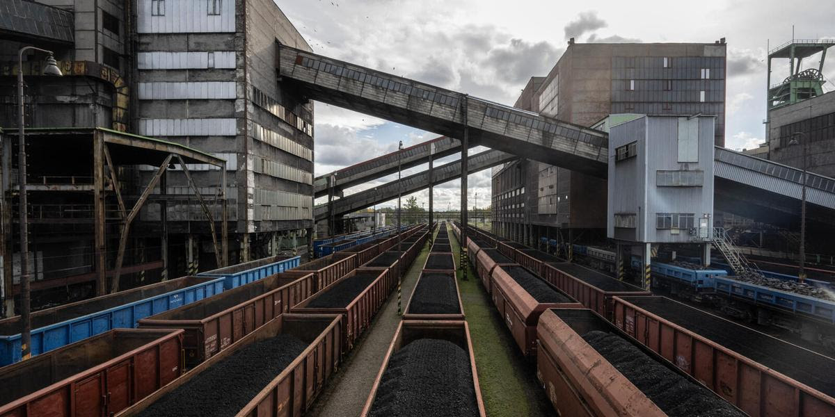 Wagons of a cargo train transporting hard coal are seen at the CSM hard coal mine, which is the last hard coal mine of the Czech Republic and operated by the OKD mining company, on October 14, 2024 in the village of Stonava near Karvina, Czech Republic. (Photo by Michal Cizek / AFP)