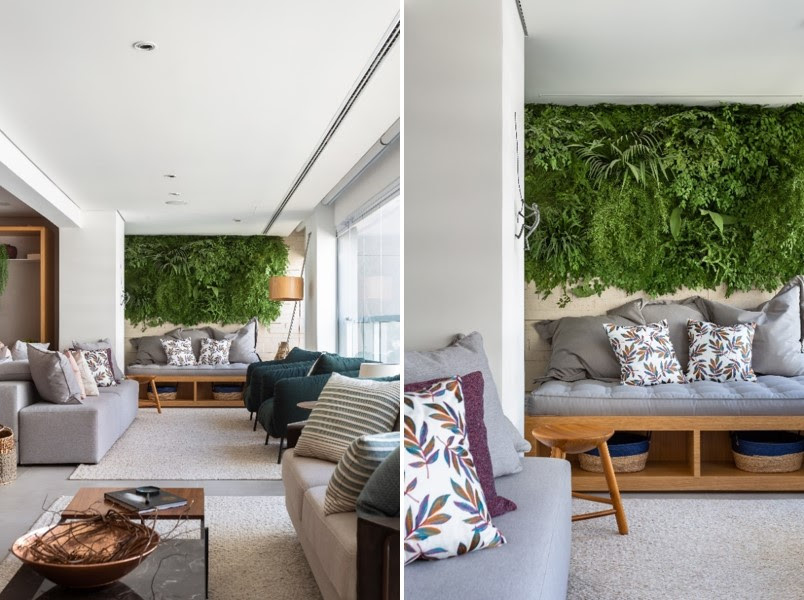 Nessa área social integrada projetada pelas arquitetas do Studio Tan-gram, a varanda ganhou uma sala de estar. E enfatizando a essência do local, ao fundo, uma parede verde é acompanhada por um sofá com estrutura de marcenaria e futon. Uma ode ao relax! | FOTO: Estúdio São Paulo