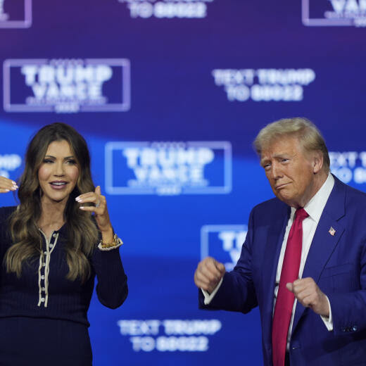 Republican presidential nominee former President Donald Trump and South Dakota Gov. Kristi Noem dance to the song "Y.M.C.A." at a campaign town hall at the Greater Philadelphia Expo Center & Fairgrounds, Monday, Oct. 14, 2024, in Oaks, Pa. (AP Photo/Matt Rourke)