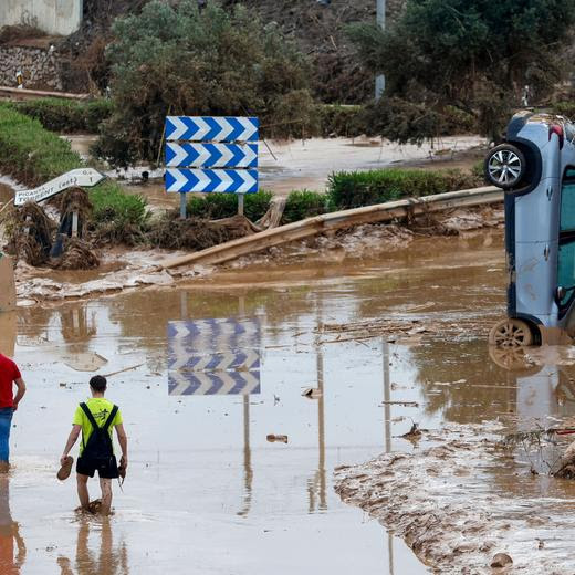 epaselect epa11694689 People walk in a mud-covered road in the flood-hit city of Picanya, province of Valencia, Spain, 31 October 2024. More than 150 people died in the province of Valencia and neighboring provinces following floods caused by the DANA (high-altitude isolated depression) phenomenon impacting the eastern part of the country. EPA/MIGUEL ANGEL POLO