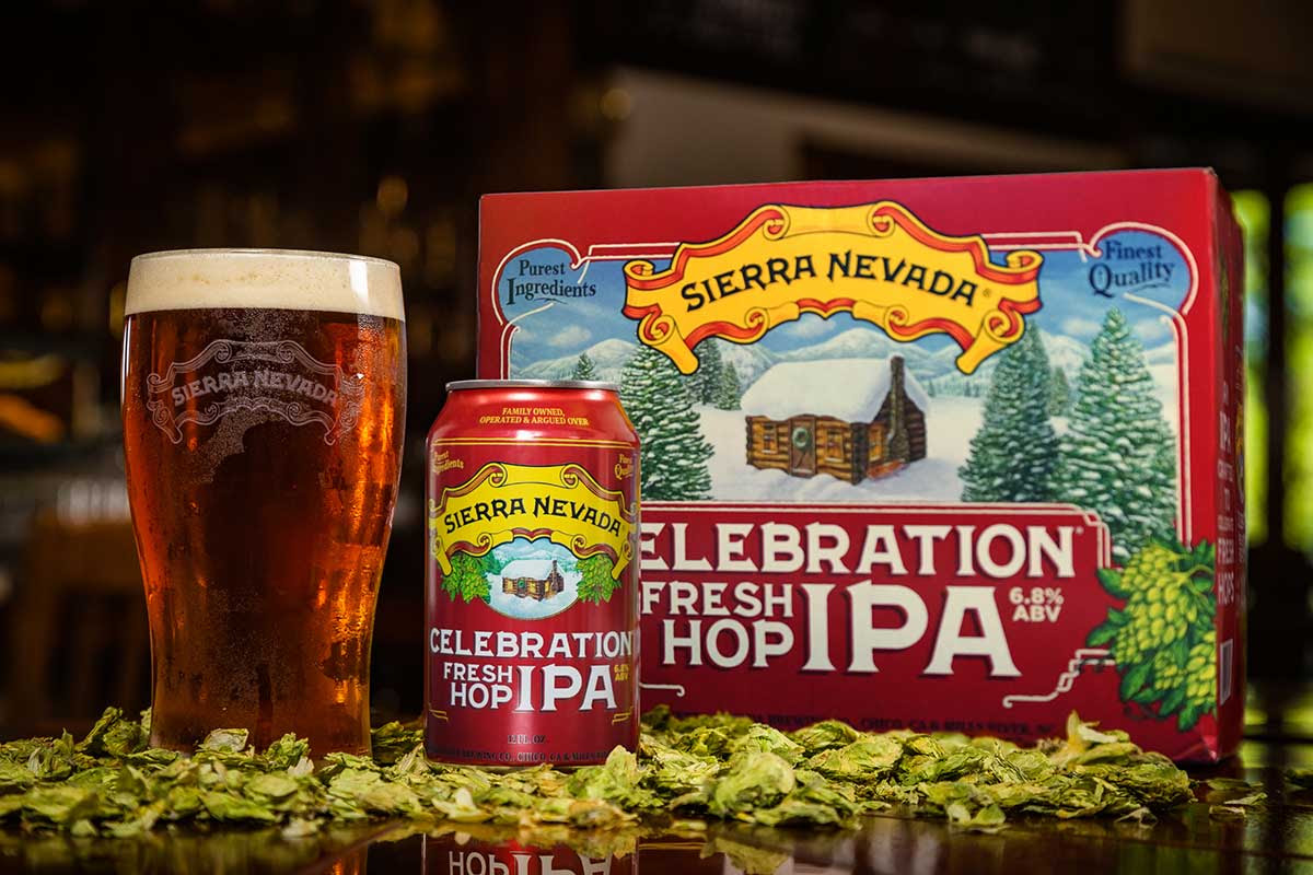 A full glass, can, and 12-pack of Celebration IPA