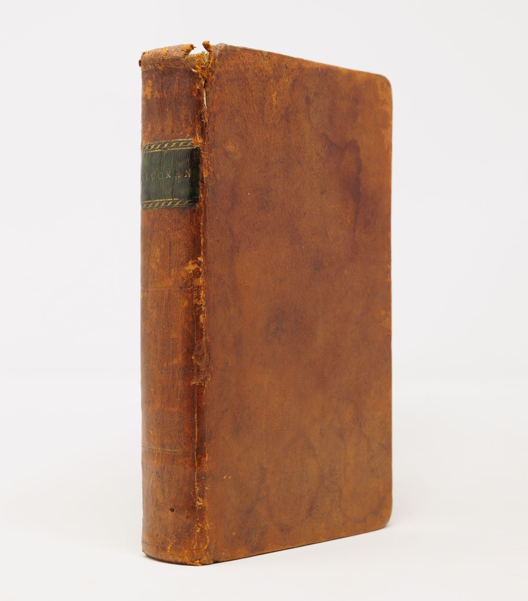 The binding of an 1806 Quran, brown sheep with a green label