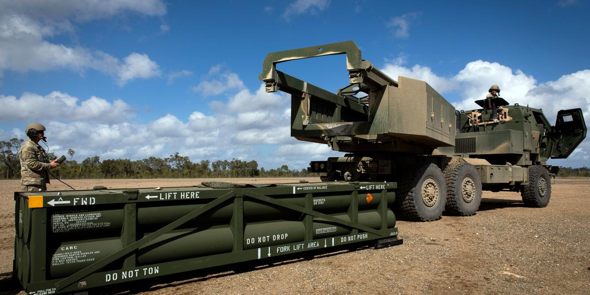 FILE - In this image provided by the U.S. Army, U.S. Army Sgt. Ian Ketterling, gunner for Alpha Battery, 1st Battalion, 3rd Field Artillery Regiment, 17th Field Artillery Brigade, prepares the crane for loading the Army Tactical Missile System (ATACMS) on to the High Mobility Artillery Rocket System (HIMARS) in Queensland, Australia, on July 26, 2023. (Sgt. 1st Class Andrew Dickson/U.S. Army via AP)