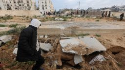 Palestinians check damaged graves at a cemetery following an Israeli raid in Khan Younis, Gaza, on January 17.