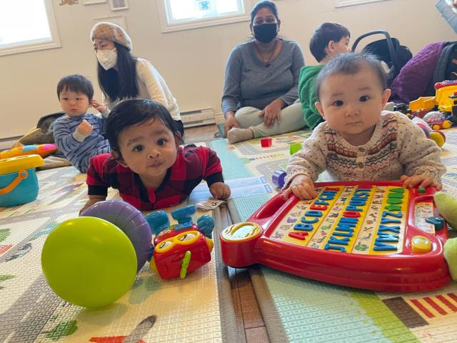 Infants, toddlers, and parents playing at Fairview Resource centre