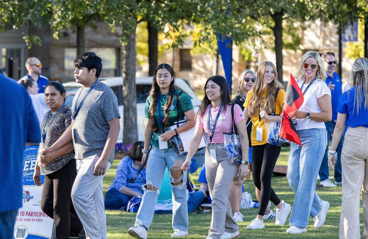 Photo of students walking at a Tours & Tailgates event on UTulsa's campus