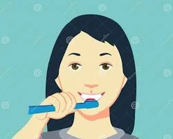 woman brushing her teeth with herbal toothpaste