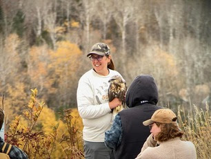 Naturalist Sara with Rough-legged Hawk by M Chappell