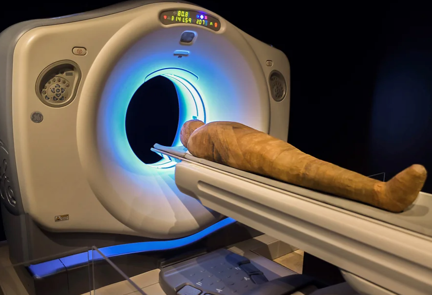 Mummy being inserted into a CT scanner