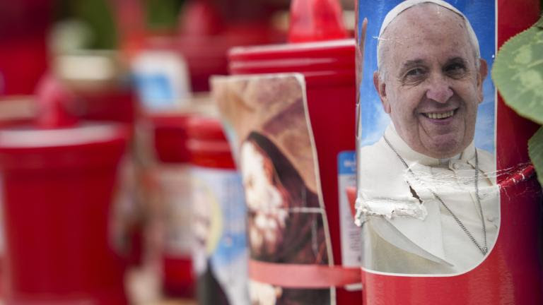 A candle with a portrait of Pope Francis is seen in front of the Agostino Gemelli Polyclinic, in Rome, Tuesday, Feb. 18, 2025, where Pope Francis has been hospitalised to undergo some necessary diagnostic tests and to continue his ongoing treatment for bronchitis. (AP Photo/Andrew Medichini) Associated Press / LaPresse Only italy and Spain