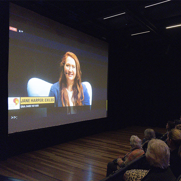 A screen livestreaming Jane Harper to an audience watching the Festival Live and Local Program