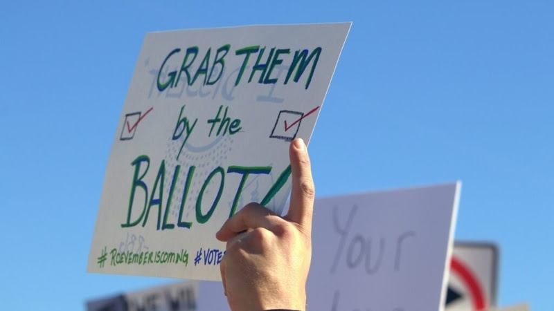 Protesters rallied for reproductive rights in Scottsdale after the Arizona Supreme Court ruled to reinstate a 19th century abortion ban this spring. Lawmakers quickly repealed the statute, and voters restored abortion rights last month. (Gloria Rebecca Gomez/Arizona Mirror) 