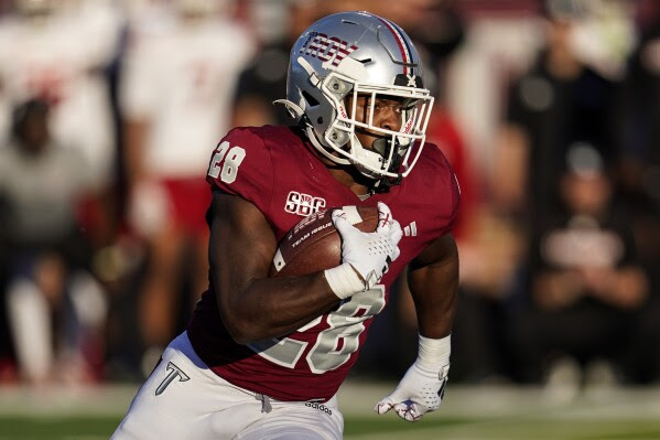 Troy running back Kimani Vidal (28) runs against the Louisiana-Lafayette during the first half of an NCAA college football game, Saturday, Nov. 18, 2023, in Troy, Ala. (AP Photo/Mike Stewart)