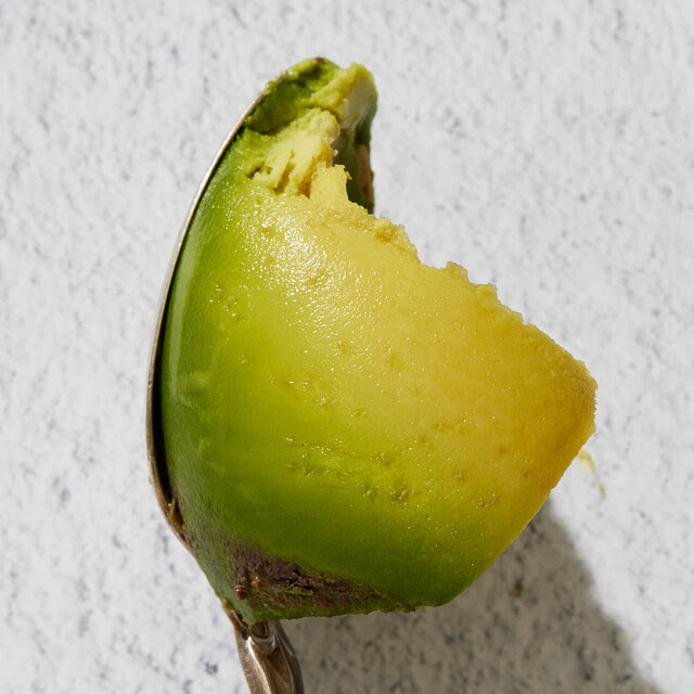 A close-up of a spoonful of creamy avocado.