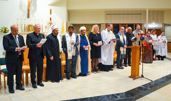 Religious leaders from Potomac Area Interfaith Communities offer communal prayer at the 2022 annual Thanksgiving Interfaith Service at St. Raphael’s Catholic Church on Falls Road in Rockville. (Photo courtesy of Potomac Area Interfaith Communities)