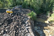 An excavator places stones at the site of the demolished dam. Credit: Cowlitz Indian Tribe