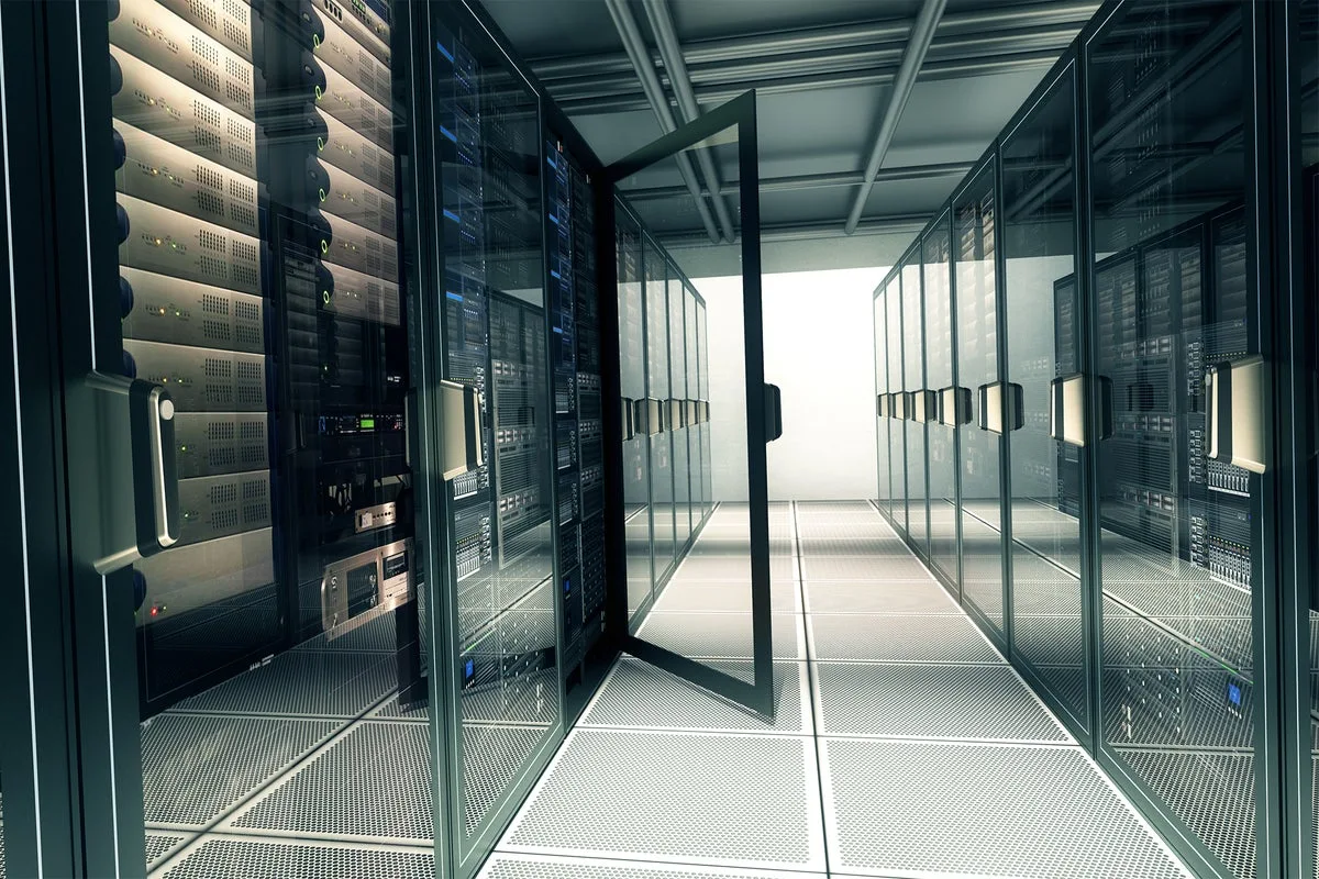 Photo illustration of an aisle in a server room with a door open on one of the equipment cases