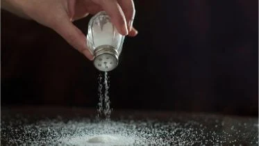 Sprinkling Salt on Table Concept