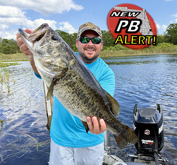 Angler with trophy Florida bass, "PB Alert" image