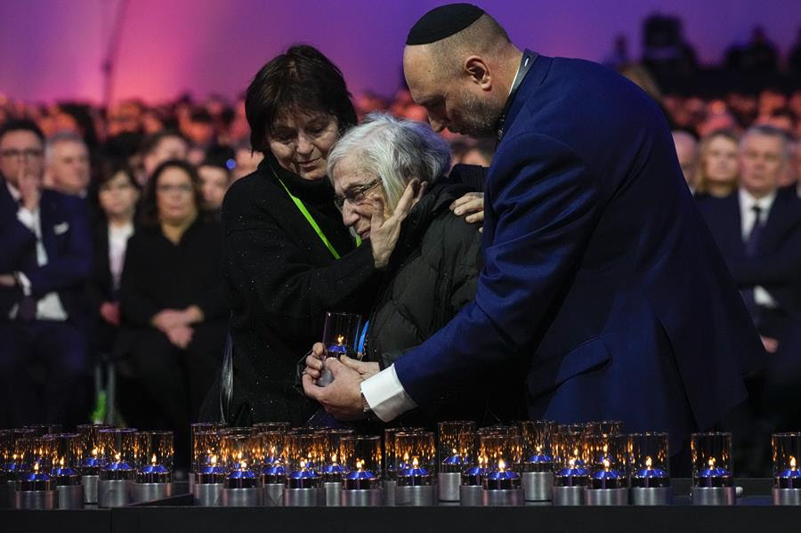 Auschwitz survivors, world leaders and others gather to place candles at the Auschwitz memorial.