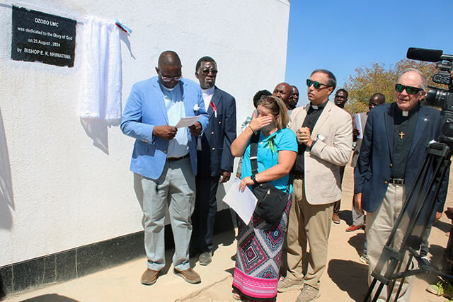 Amy Carmon, a member of Mary’s Chapel United Methodist Church in Bean Station, Tennessee, gets emotional during the dedication ceremony for Dzobo United Methodist Church in rural Zimbabwe. Photo by Kudzai Chingwe, UM News.