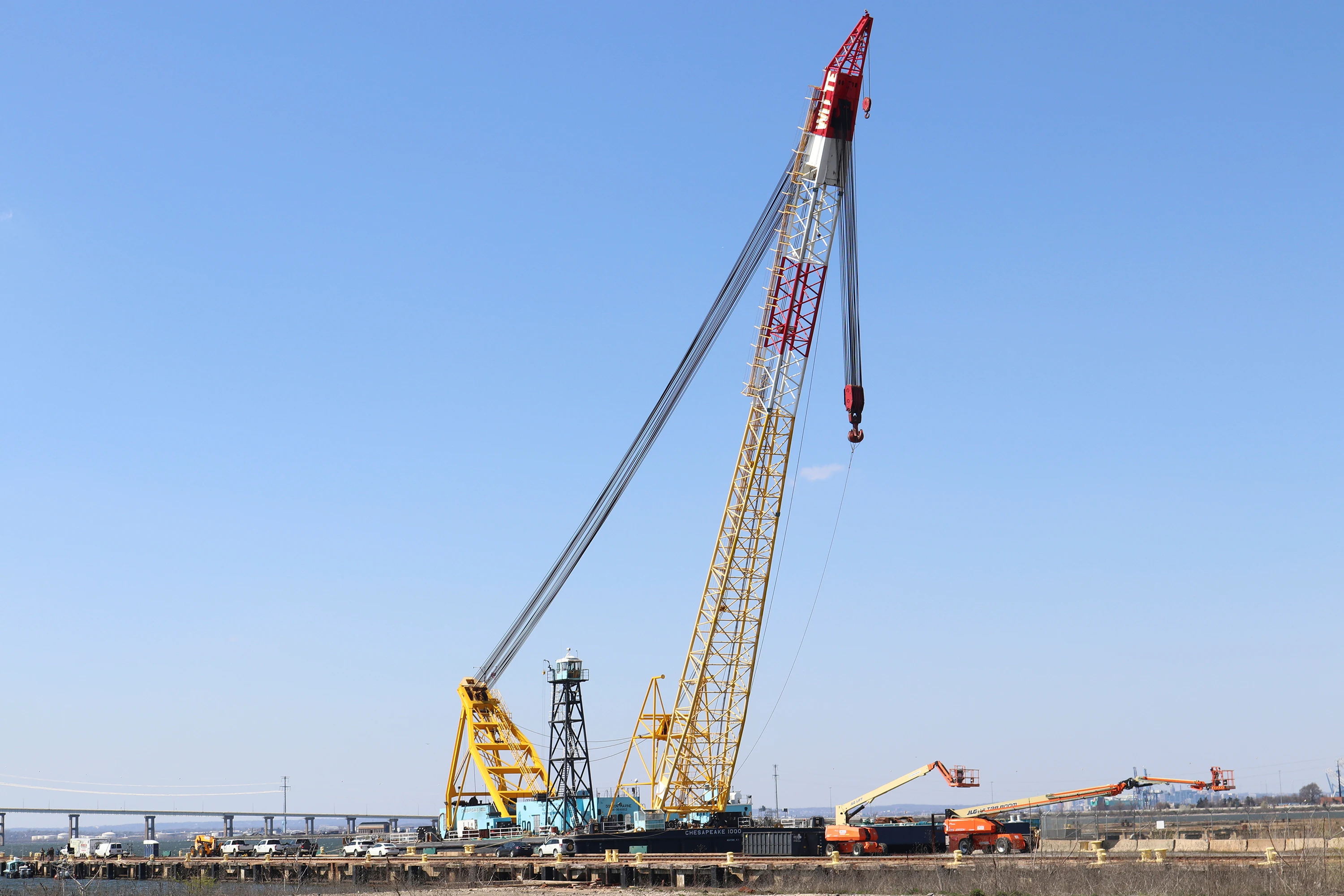 The Chesapeake 1000 crane, which will be used to help remove wreckage from the collapse of the Key Bridge, is docked at Tradepoint Atlantic in Sparrows Point, Md.