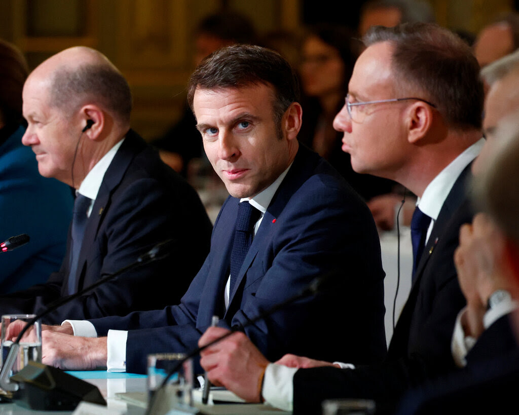 Several men at a conference table.