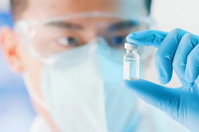 Medical Researcher Holding Vaccine Vial