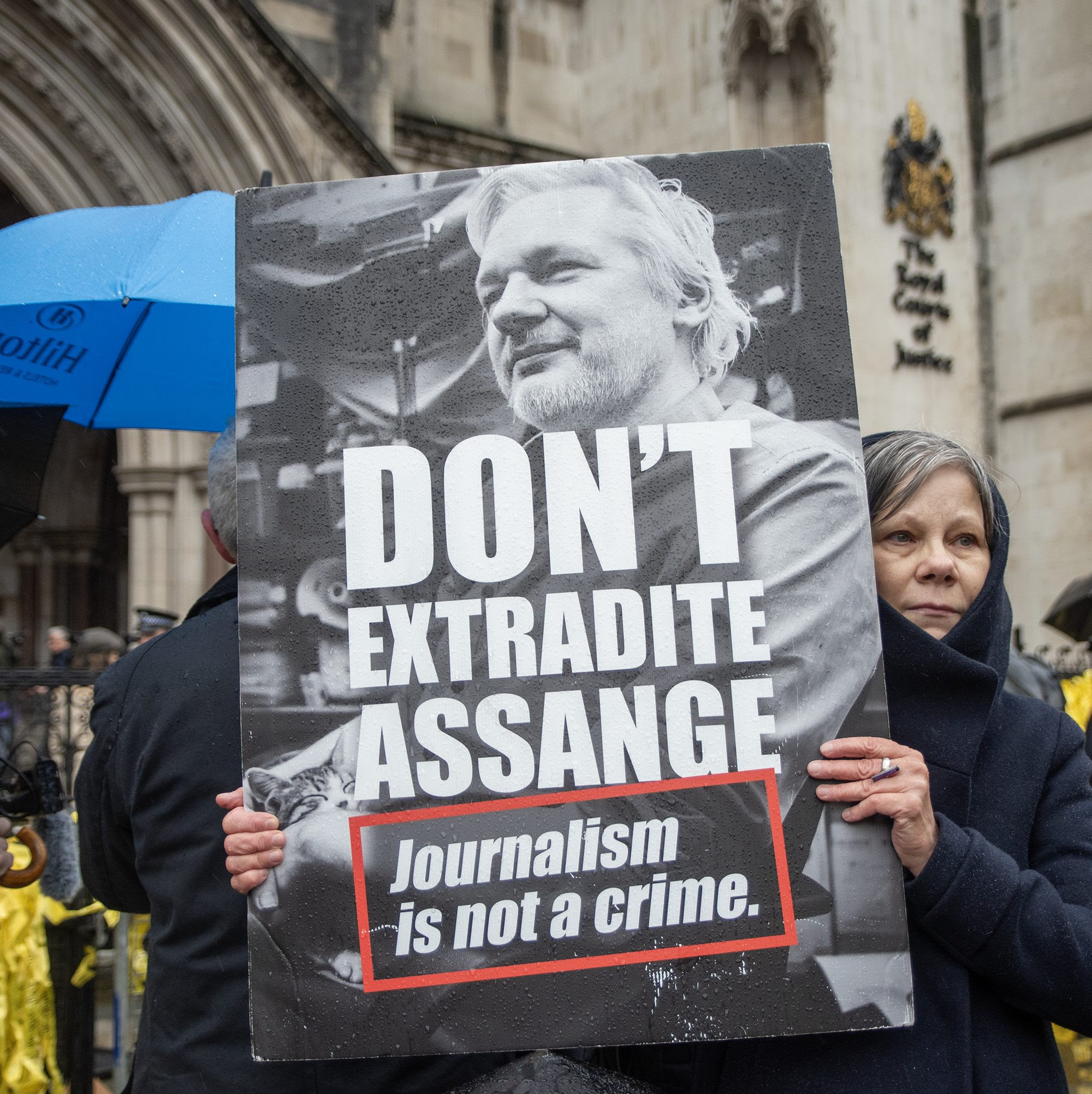 A protester holds a placard outside the Royal Court of Justice during the demonstration. Hundreds of protesters gathered on the second day of Julian Assange's trial in front of the Royal Court of Justice in London, UK. Photo by Krisztian Elek/SOPA Images/LightRocket via Getty Images