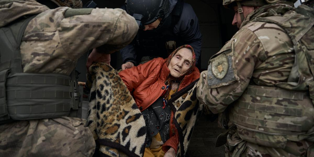 POKROVSK DISTRICT, UKRAINE - NOVEMBER 14: The White Angels National Police Evacuation Team helps evacuate a bedridden elderly woman on November 14, 2024 in the Pokrovsk District, Ukraine. (Photo by Kostiantyn Liberov/ Libkos/Getty Images)