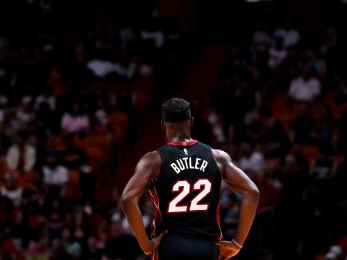 A photo of Jimmy Butler, of the Miami Heat, pictured from the rear, looking on during a game against the Cleveland Cavaliers.