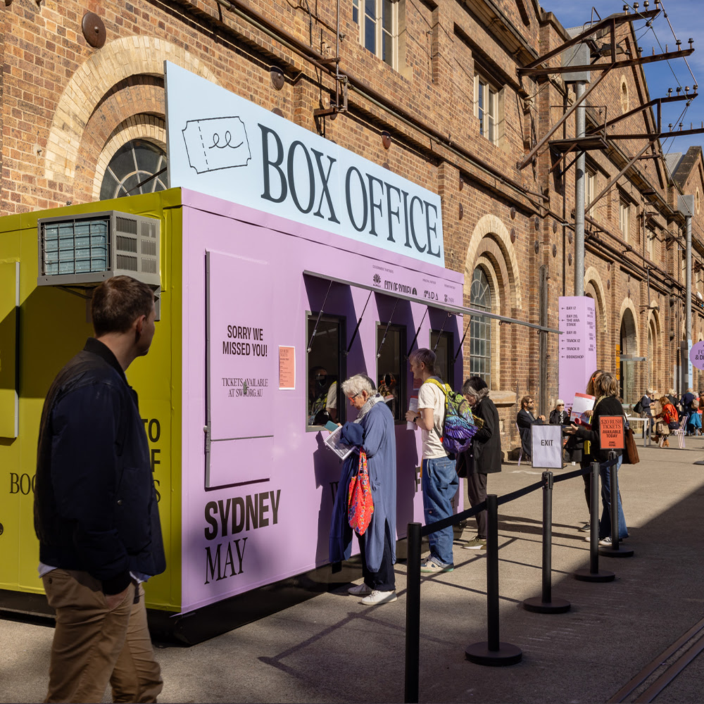 Green and purple box office stationed outside of Carriageworks