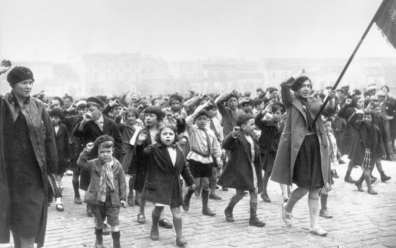 Children singing “The Internationale” in a communist-led May Day parade, Paris, France, 1934. Getty Images.