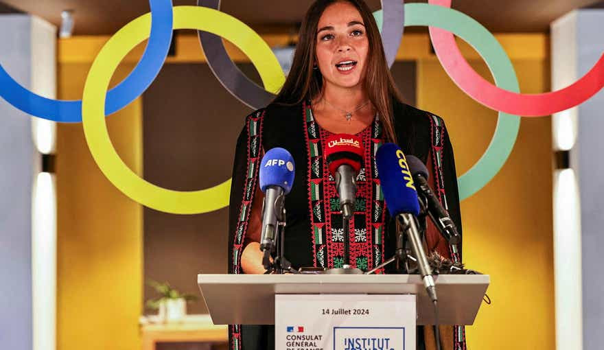 Palestinian-US swimmer Valerie Rose Tarazi speaks during the send-off ceremony for the Palestine delegation to the upcoming Paris 2024 Olympic Games in Ramallah, Sunday.