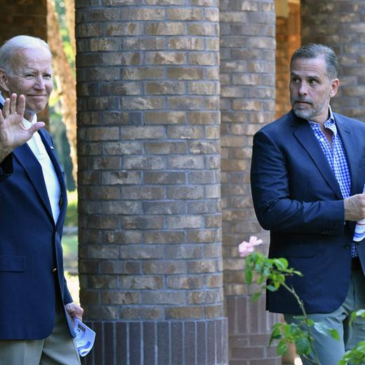 (FILES) US President Joe Biden (L) waves alongside his son Hunter Biden after attending mass at Holy Spirit Catholic Church in Johns Island, South Carolina on August 13, 2022. US President Joe Biden on December 1, 2024 said he had issued an official pardon for his son Hunter, who is facing sentencing for two criminal cases related to tax evasion and the purchase of a firearm. "No reasonable person who looks at the facts of Hunter’s cases can reach any other conclusion than Hunter was singled out only because he is my son -- and that is wrong," the president said in a statement, calling it "a miscarriage of justice." (Photo by Nicholas Kamm / AFP)