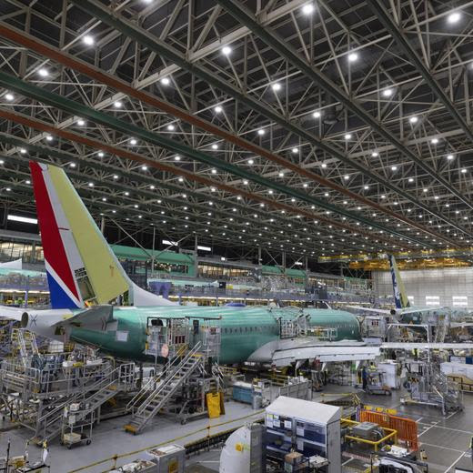 FILE - Boeing employees work on the 737 MAX on the final assembly line at Boeing's Renton plant, June 15, 2022, in Renton, Wash. (Ellen M. Banner/The Seattle Times via AP, Pool, File)