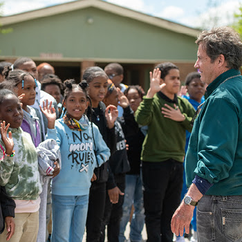 A group of students take the junior ranger pledge, promising to go outside more. 