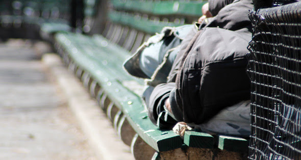 Homeless man on a bench in NYC